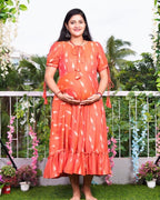 Tangy orange frill ikat maternity dress