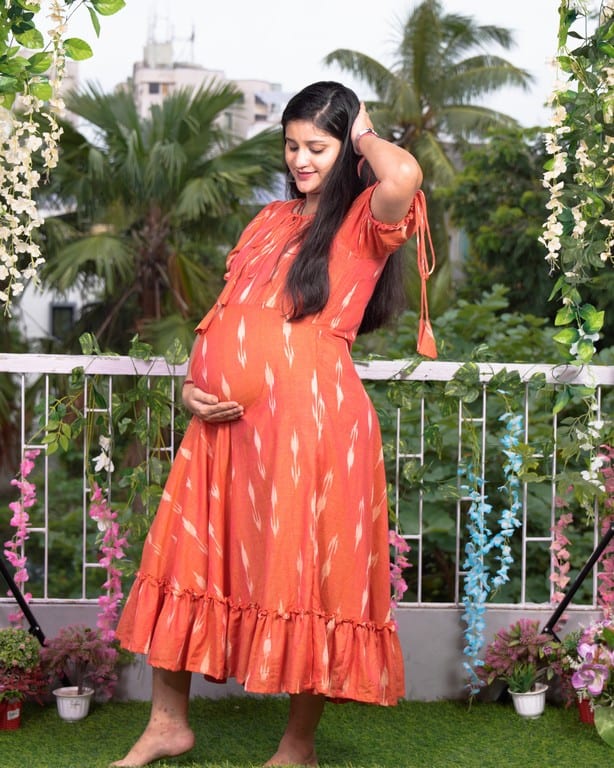 Tangy orange frill ikat maternity dress